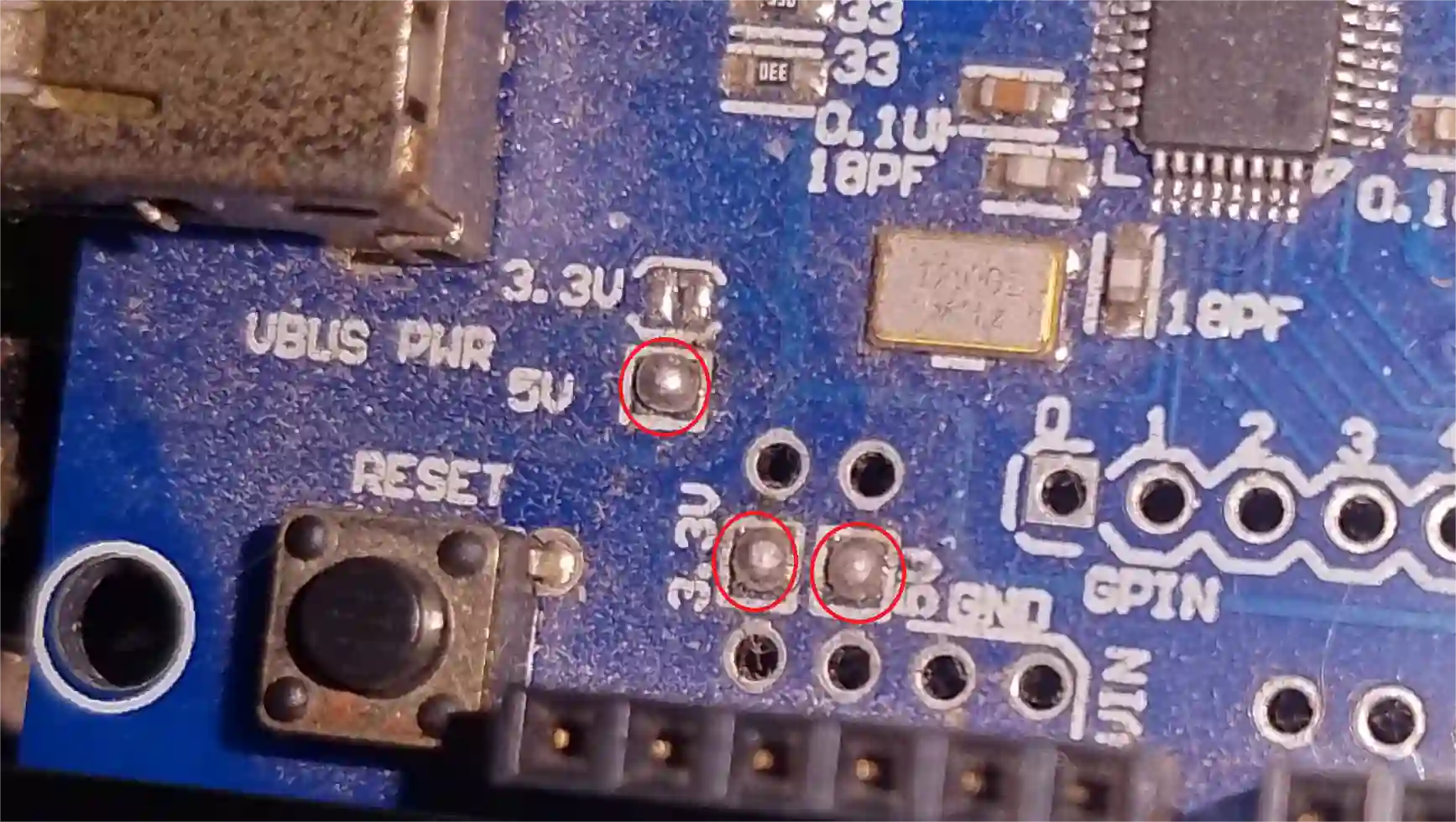 Host Shield soldering points - red circles indicate where to solder